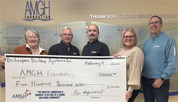Group of people standing with a novelty cheque for