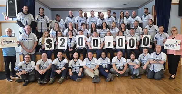 A group of Hurontel employees holding up $200,000